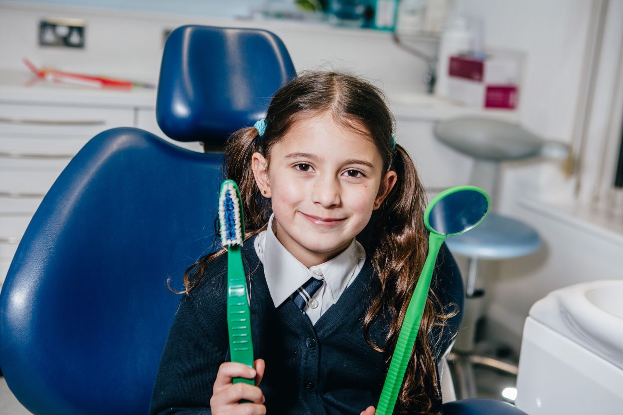 Happy child in the dentist's chair at Atkinson Brignall